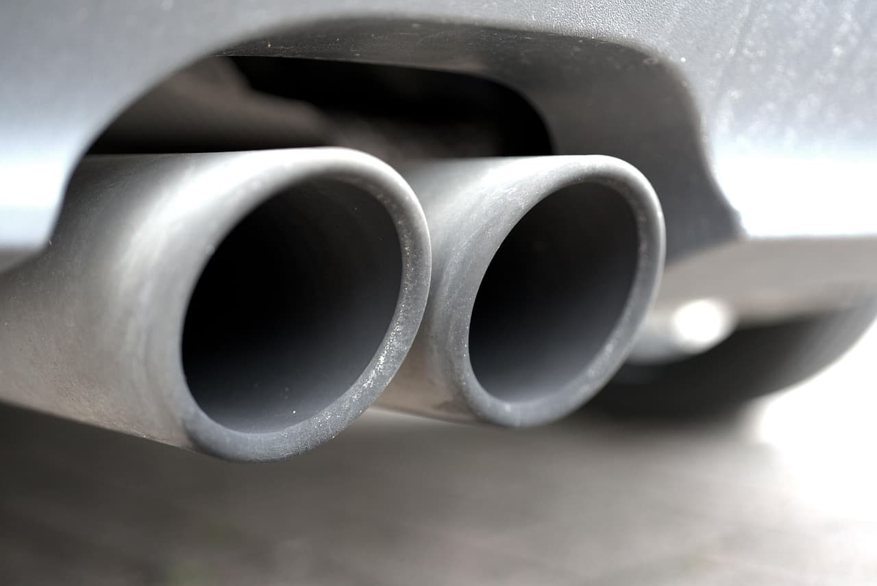 Twin exhaust tailpipes under a car